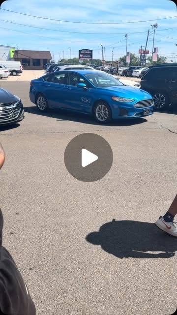 Delivery day — couple with new purchase at the lot